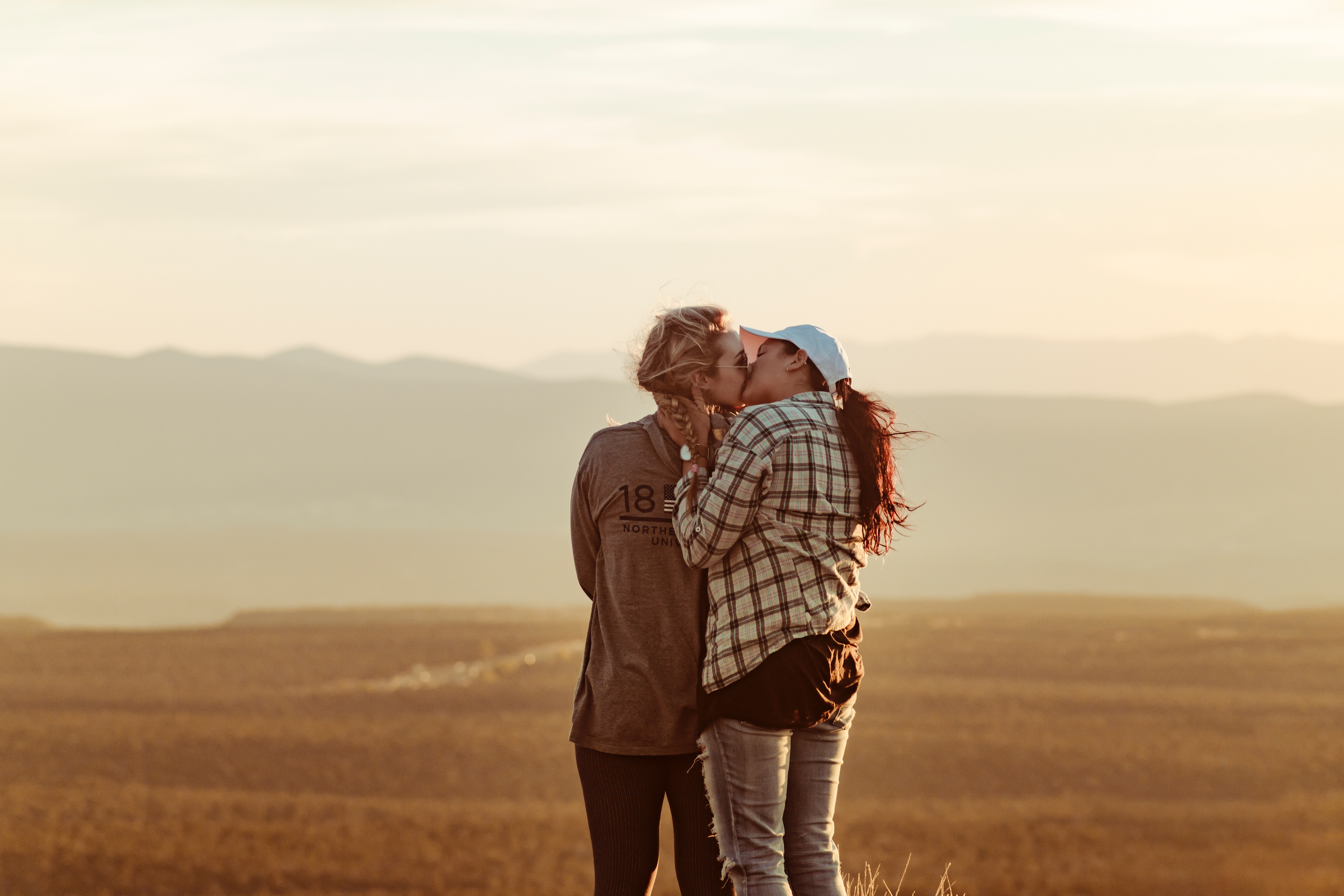 Two women kiss, representing how couples counseling Connecticut can help improve your relationship.