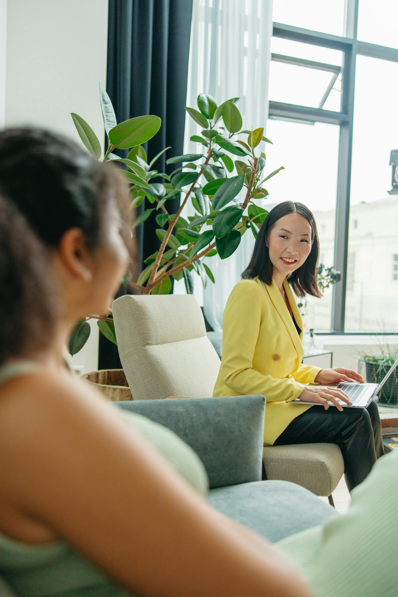 An image of a family of three, consisting of an adult, a baby, and a child, standing together and looking at each other with love and affection. The focus of the image is on their connection, representing the importance of family relationships. The image promotes the idea of seeking family therapy in Connecticut, where families can work together to improve communication and overcome challenges. The image evokes a sense of warmth and the idea that with support and guidance, families can build stronger and happier relationships.